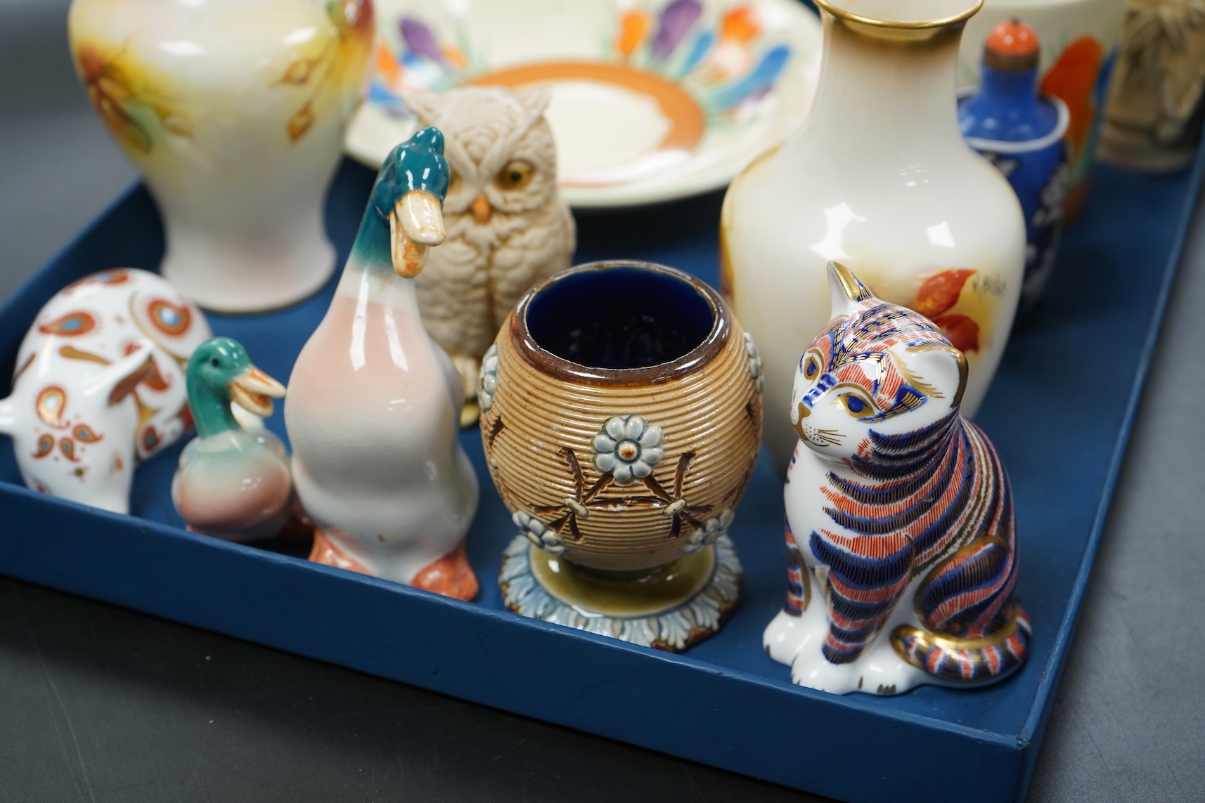 A collection of mixed porcelain and pottery to include four Worcester vases, one signed H. Blake, Clarice Cliff crocus pattern cup, saucer and sugar bowl and two Doulton Imari paperweights, largest 13cm high